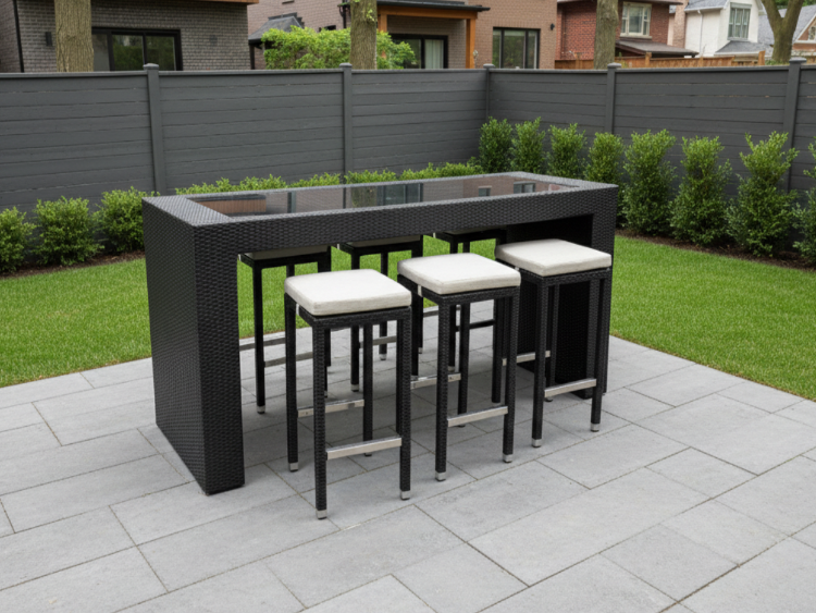 Outdoor patio set with a rectangular bar table and six stools on a paved patio.